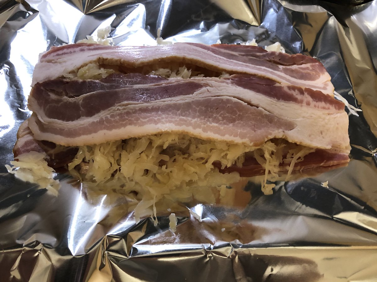 yardsaleartist's tweet photo. Bratwurst on the grill tonight. 

What’s in the foil packet? Bacon-layered sauerkraut, of course!

#GermanDinner https://t.co/Z9K1MaU43e