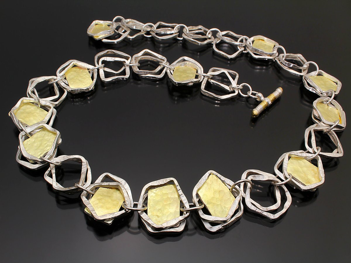 Craft2WearSWC's tweet photo. Jeweler Sana Doumet creates distinctive pieces by mixing sterling silver with high karat gold &amp; precious stones in geometric shapes for a refined and stylish look. At the Virtual Smithsonian Craft Show, 10/23-31.

https://t.co/qgRfB9uCoF
@smithsonian
#CraftInAmerica
#FineCraft https://t.co/EUN74T9uX3