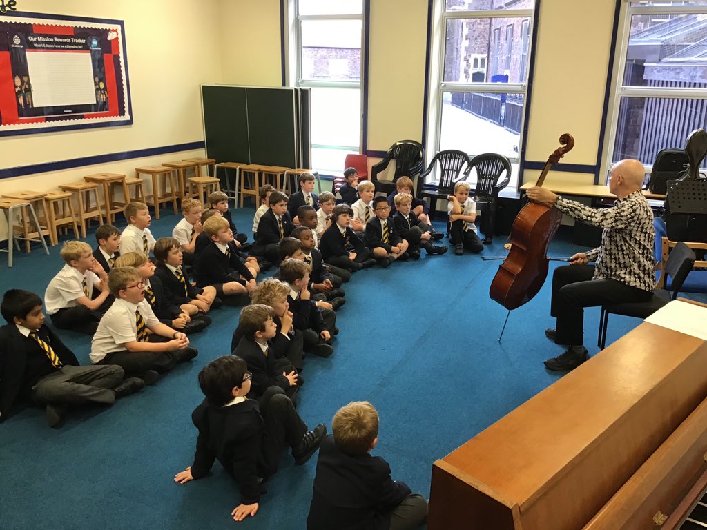 qehjuniors's tweet photo. The boys in Years 3 and 4 enjoyed a wonderful cello demonstration from Mr Mullan today, one of the many peripatetic teachers who visit QEH to teach music. @QEHSchool @QEHMusic #qehcare #qehcommunity #qehcharacter #qehschool https://t.co/6cGPyo4L82