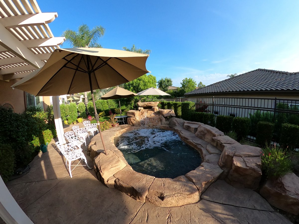 GotSplash's tweet photo. A tropical rock spa adds luxury to this small backyard!  
.
.
#spadesign #luxuryspas #backyarddesign #tropicalpool https://t.co/zYlKdl0xms