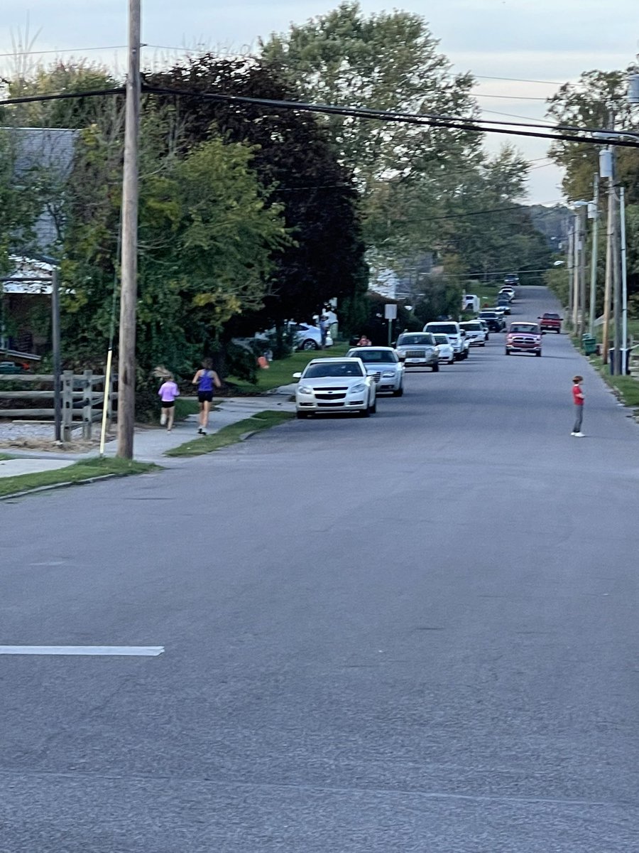 CoachKevinBoard's tweet photo. Little eyes are always upon you! @HambelSydney getting some mileage in tonight around town. As she’s running, a small girl asks if she could run with her; Sydney slowed down to let her run along side her. https://t.co/wZ7OaquyyA
