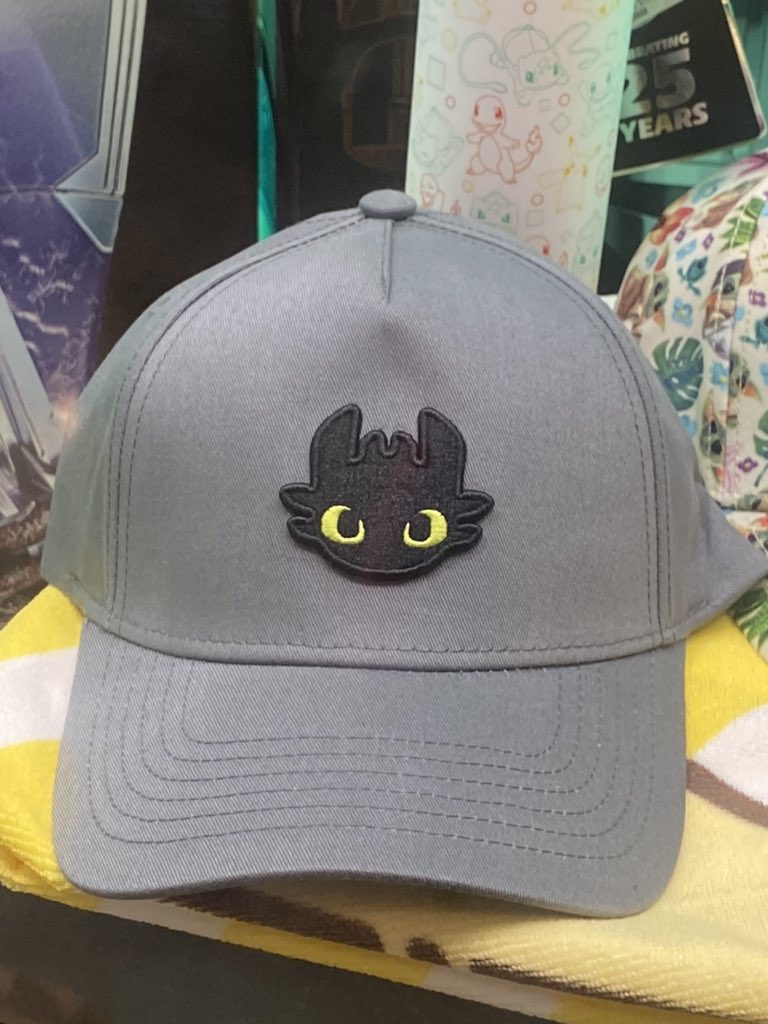 HTTYD_AU's tweet photo. #Toothless merch spotted and available at @ZingPopCulture! Baseball cap and backpack were found at a store in South Sydney. 
Do you have #HTTYD news to share with Australia? Let us know @HTTYD_AU! https://t.co/mjFlWKmkbS