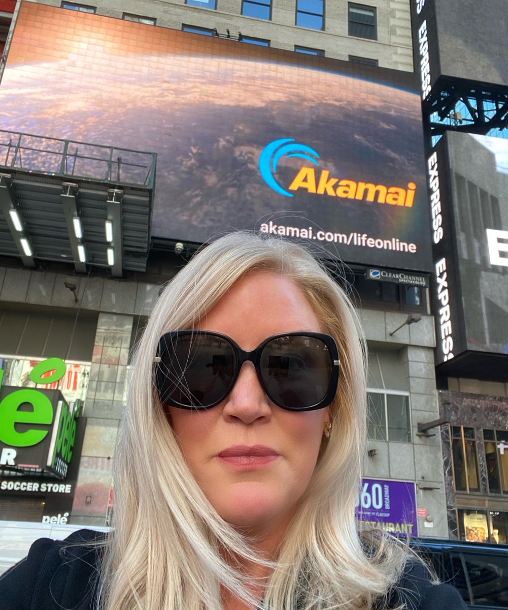 Akamai's tweet photo. Big ideas brought to life on the big screen! Akamai employees take in our #TimesSquare billboard. Stop by, take a selfie, and tag #LifeWithAkamai. https://t.co/7iYLMrR0eY https://t.co/QoAZ4zAzuB