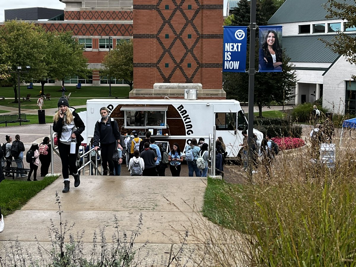 Student gather in front of Kirkhof to buy baked goods. Get some while the food truck is still there!