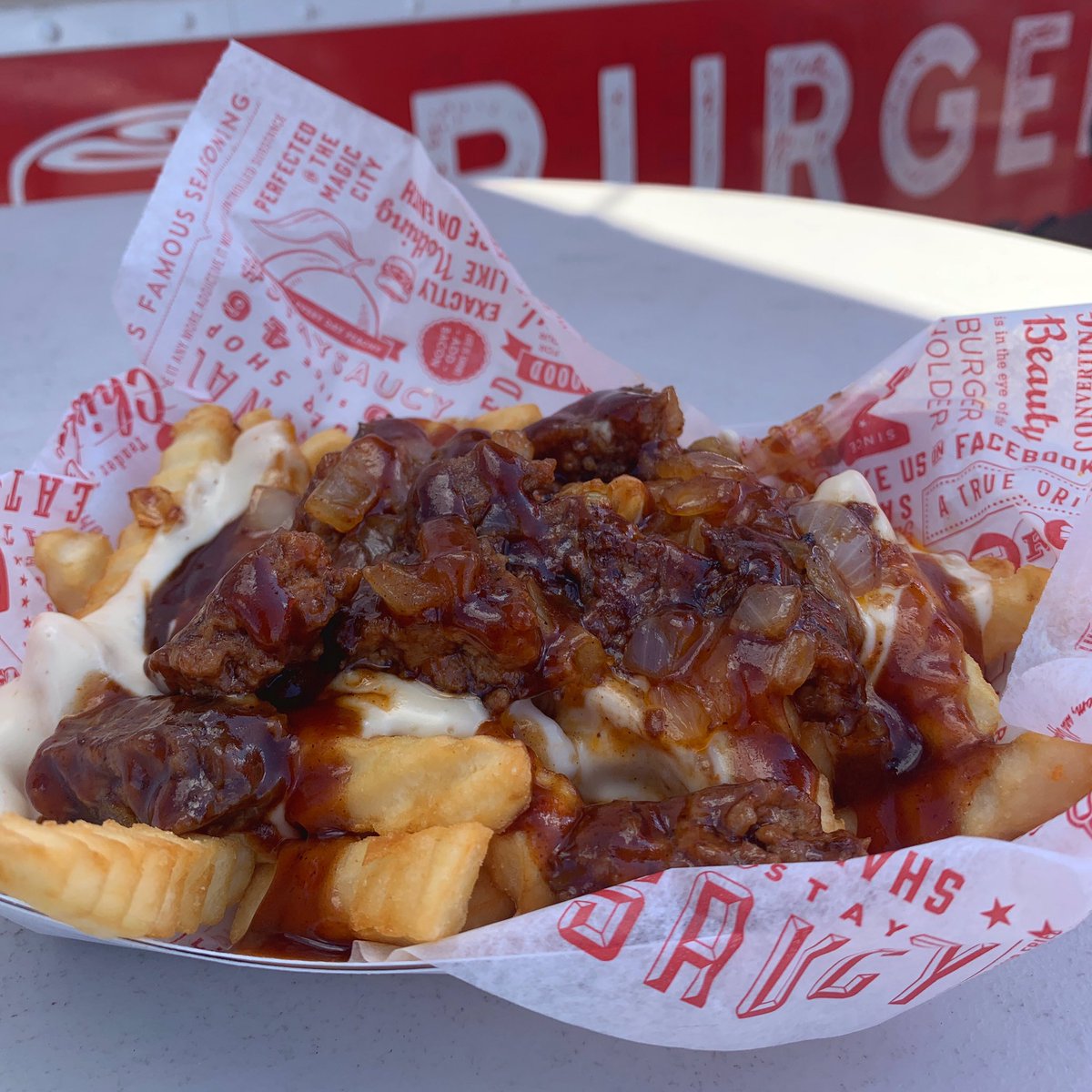 milosburgerbus's tweet photo. Our famous seasoned crinkle fries loaded with chopped up burger, grilled onions, queso &amp; lots of Milo’s sauce. 🤩

Now available on the Burger Bus for a limited time. #milossaucyfries https://t.co/BYUDeBZ0ZC