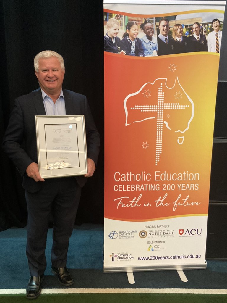 So proud of my dad. He has been with me every step of my teaching career. But 40 years in Catholic Education and can’t hold a certificate the right way 🤣❤️