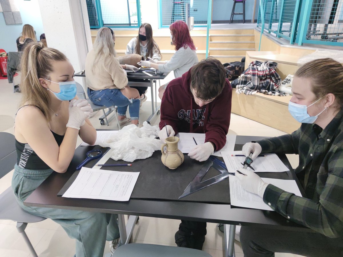 DrKenGriffin's tweet photo. Thanks to the wonders of Zoom, Christian can lead the session remotely while I help the students with their vessels from @TheEgyptCentre. Today is the first time they have seen them, so some initial observations and training on measuring them! #objectcentredlearning @SwanseaUni https://t.co/Kxwh40FPnD