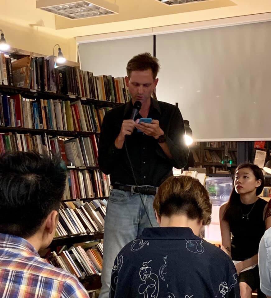 Here’s a picture of me reading at <a href="/bleakhousebooks/">Bleak House Books</a> during a <a href="/hongkongpen/">PEN Hong Kong</a> reading.

The book store has closed by now, but I’ll always be grateful for the memories &amp; friends I met there 😢

Context: Hong Kong independent bookstore Bleak House Books to close

hongkongfp.com/2021/08/29/hon…