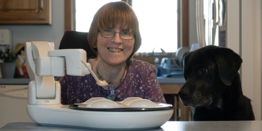 ObiRobot's tweet photo. Table for two! 😊🐶 Buffy the service dog and his mom enjoy a meal! #obirobot #occupationaltherapists #assistivetech https://t.co/DxqDsay9kg