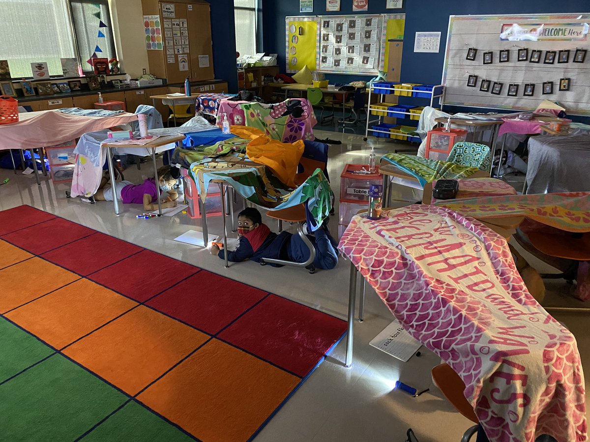PBIS reward day! The class chose a “camp-in”, so we’re enjoying Fundations in our “tents” by flashlight! @CaleyPBIS