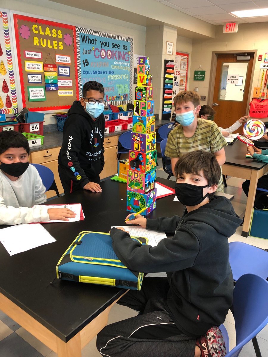RMS FACS students during a child development unit - playing with toys to identify age appropriateness, safety concerns, and ways children can learn from the particular toys.
