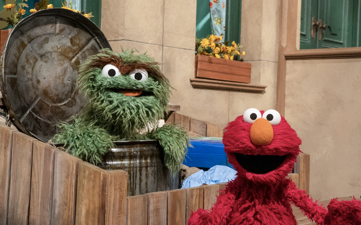 elmo's tweet photo. Elmo heard it's #NationalGrouchDay so Elmo ran over to @OscarTheGrouch's trash can to say, "Hi!" It made Oscar extra grouchy. Ha ha ha! https://t.co/IH9FPhvfAp