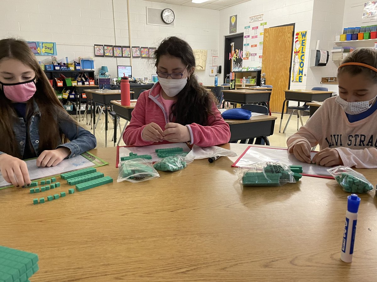We had a great hands on lesson today learning to regroup while multiplying ! @Principal_UGL