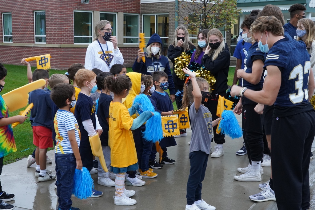 DCDSchool's tweet photo. The weather can't dampen our school spirit! The Lower School kicked off their Friday morning with a Pep Rally! Thank you to the members of the Football team, Cheer team, and Pep band for making the morning a special one! #dcds #dcdsspirit #dcdshomecoming #independentschool https://t.co/KVjh6lhktw