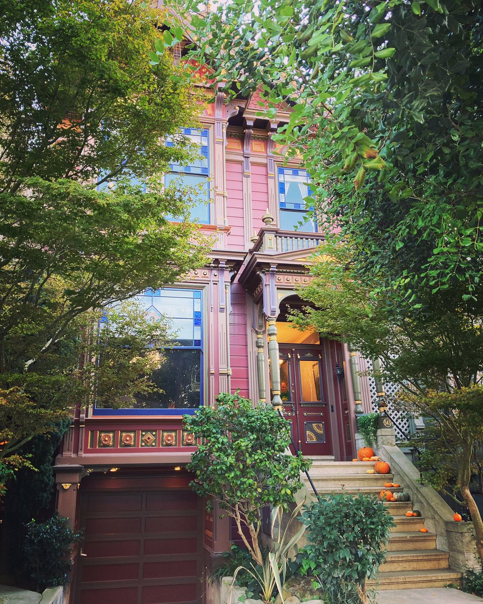 shivaunsay's tweet photo. I have to walk up steep hills to see this burgundy Victorian. Pumpkins are cascading down the steps so a photo was merited. I see a person standing behind the front doorβ¦ or, maybe itβs the house ghost. π»π #miniaturepumpkins #victorianhouse #sfvictorian #houseghost #burgundy https://t.co/2GiKzsd1zr