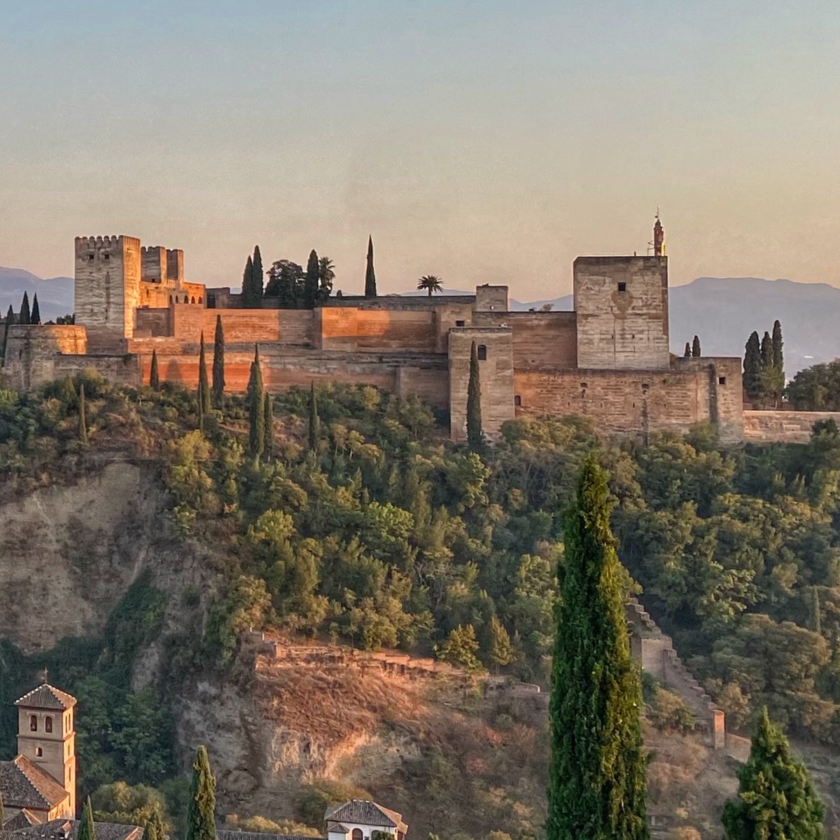 TravelingWithS's tweet photo. The Alhambra at sunset as seen from the Albaicin neighborhood of Granada, Spain. This was our dinner view on a beautiful night during our #triptospain #granada #Spain #alhambra #ifwtwa https://t.co/nW3GvnLoXO