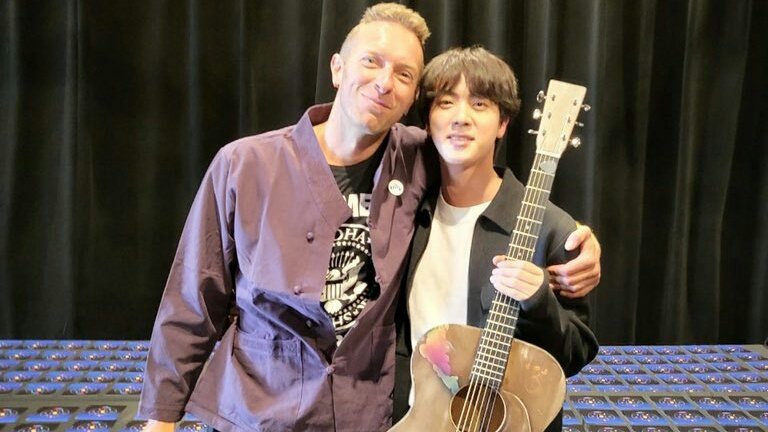 jtoni_n's tweet photo. Seokjin's giant RJ with - his gift -guitar from chris martin and a LV bag 😭 https://t.co/Tv0hgUAtnu