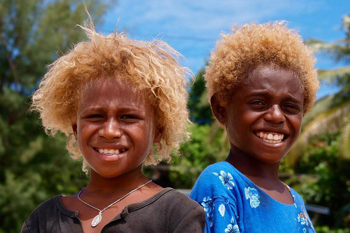 "The Melanesian people, the only ethnic group to possess both dark skin and naturally blonde hair."