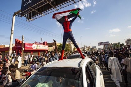 There are many things wrong with globalization. ⁦<a href="/SpiderMan/">Spider-Man</a>⁩ as an international symbol of justice &amp; truth is not one of them. Bravo to whoever was behind the mask today in #Khartoum. (Photo AFP/Getty) #SudanCoup ⁦<a href="/Marvel/">Marvel Entertainment</a>⁩