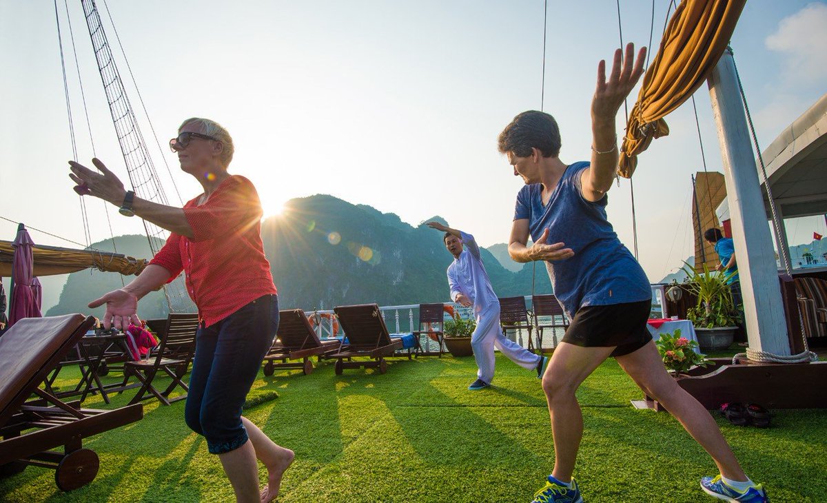 ViettinT's tweet photo. A refreshing sunrise #TaiChi lesson is one of the complementary activities on cruises in the world famous #HaLongBay. The lessons introduced on board have been simplified so that every passenger can learn how to rejuvenate the body and mind. https://t.co/f2jWJTLkma