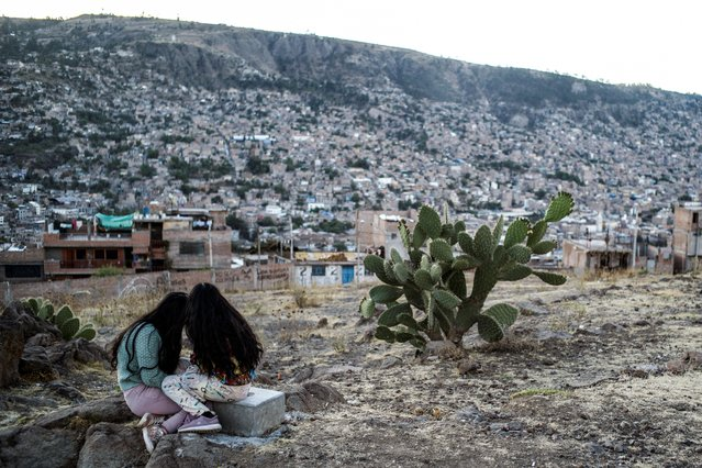 Two girls sit in a park in a region where Shining Path, the Peruvian guerrilla group whose founder Abimael Guzman recently died, was once active, in Ayacucho, Peru https://t.co/cu94jjJ7yg