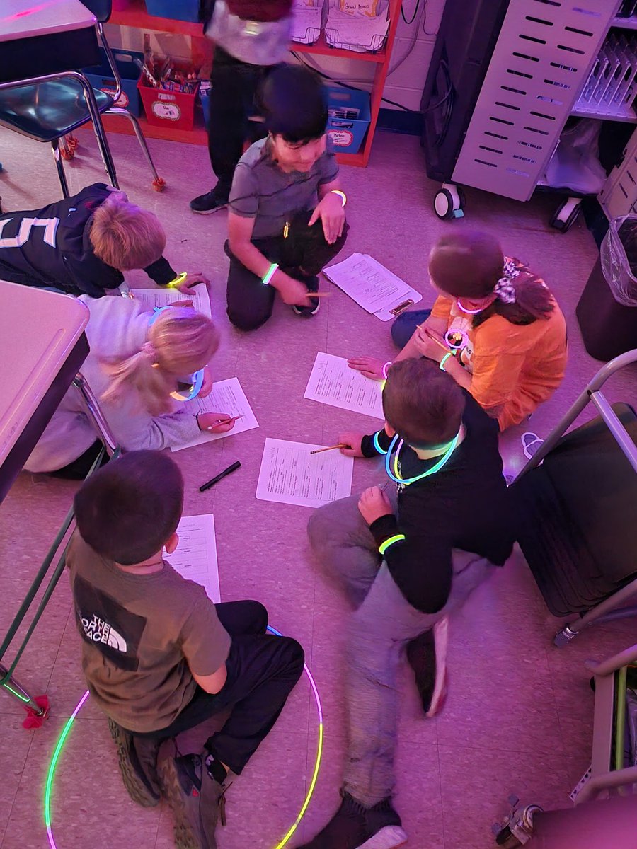 4th grade having a glow day while working on long division, main idea, theme, inferencing, etc!