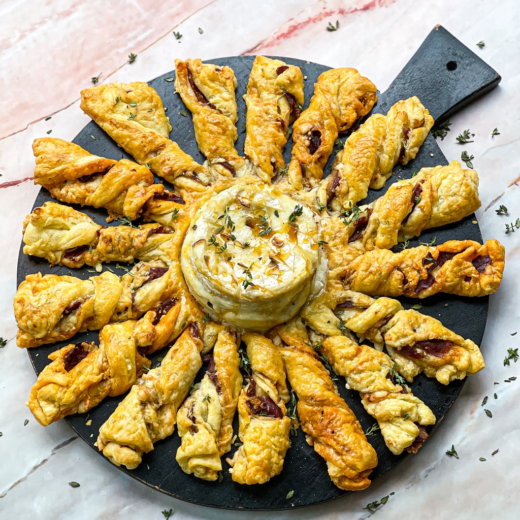 Brindisa's tweet photo. Hello again, it's @zarskitchen here taking over Brindisa's account for the weekend. 

First up… we have a gorgeous baked Cañarejal Cheese with Ibérico ham and Manchego cheese twists…

You can now find the full recipe for this over on their IG page https://t.co/MM9yMUgS3E https://t.co/2OwveNjfLe