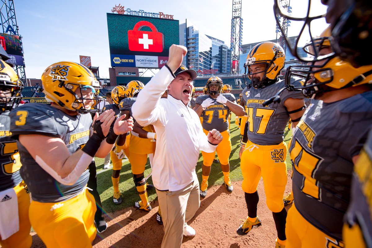 kennesawstate's tweet photo. We know all about making history at @TruistPark. 🏟️ On this #ksublackandgoldfriday, we're throwing it back to the first ever football game played at the home of the @Braves! 🏈⚾️ Join us in cheering on our neighbors in the #WorldSeries and show us your Owl pride! https://t.co/AdXdiUYbv3