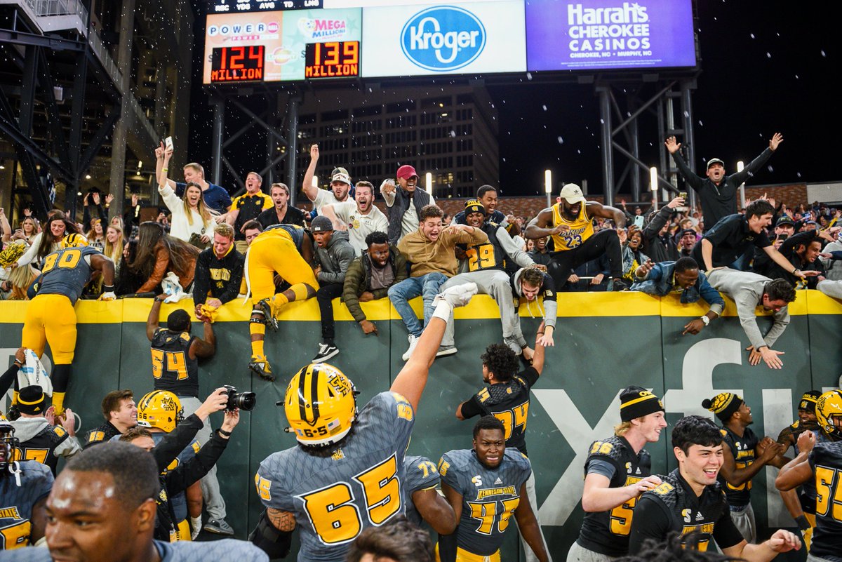 kennesawstate's tweet photo. We know all about making history at @TruistPark. 🏟️ On this #ksublackandgoldfriday, we're throwing it back to the first ever football game played at the home of the @Braves! 🏈⚾️ Join us in cheering on our neighbors in the #WorldSeries and show us your Owl pride! https://t.co/AdXdiUYbv3