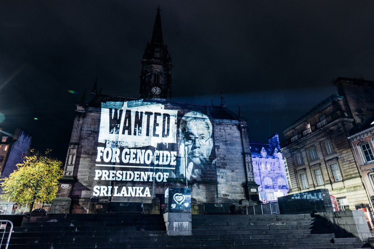 TamilGuardian's tweet photo. ‘Rajapaksa of Sri Lanka, Wanted for Genocide’ – Scottish Parliament lit up ahead of Gotabaya visit

Projections across Scotland, including on the Scottish Parliament Building in Edinburgh, called for international accountability for the Tamil genocide.

https://t.co/6ZAFuALezp https://t.co/L6ZqhLiboz