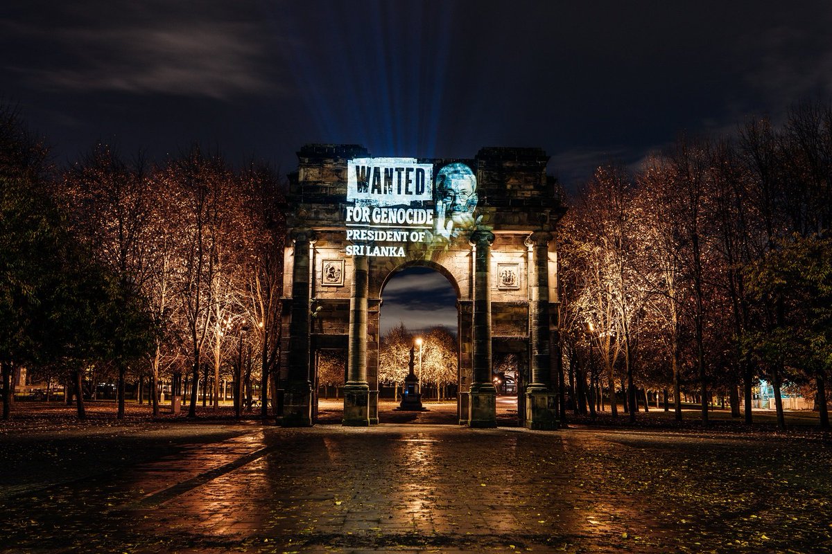 TamilGuardian's tweet photo. ‘Rajapaksa of Sri Lanka, Wanted for Genocide’ – Scottish Parliament lit up ahead of Gotabaya visit

Projections across Scotland, including on the Scottish Parliament Building in Edinburgh, called for international accountability for the Tamil genocide.

https://t.co/6ZAFuALezp https://t.co/L6ZqhLiboz