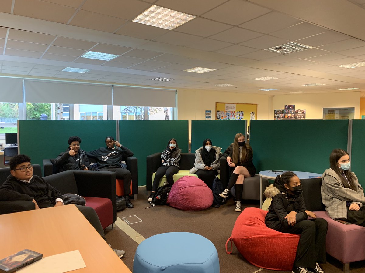 Pupils sat on sofas and beanbags listening to the introduction of the film by the People of Colour Culture Club