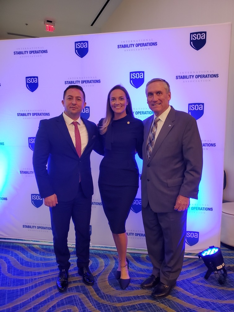 StabilityOps's tweet photo. More photos from #ISOASummit: 
- Kosovo Defense Min. @armend_mehaj, Kelley DeConciliis, Howie Lind
- ISOA's Howie Lind &amp; Michelle Quinn w/ @TAPSIntl &amp; @Bonnie_at_TAPS 
- Kelley DeConciliis receiving Chairman's award from incoming Chair Tom Lampley (@KBRincorporated) &amp; Howie Lind https://t.co/ZvELa17WSc