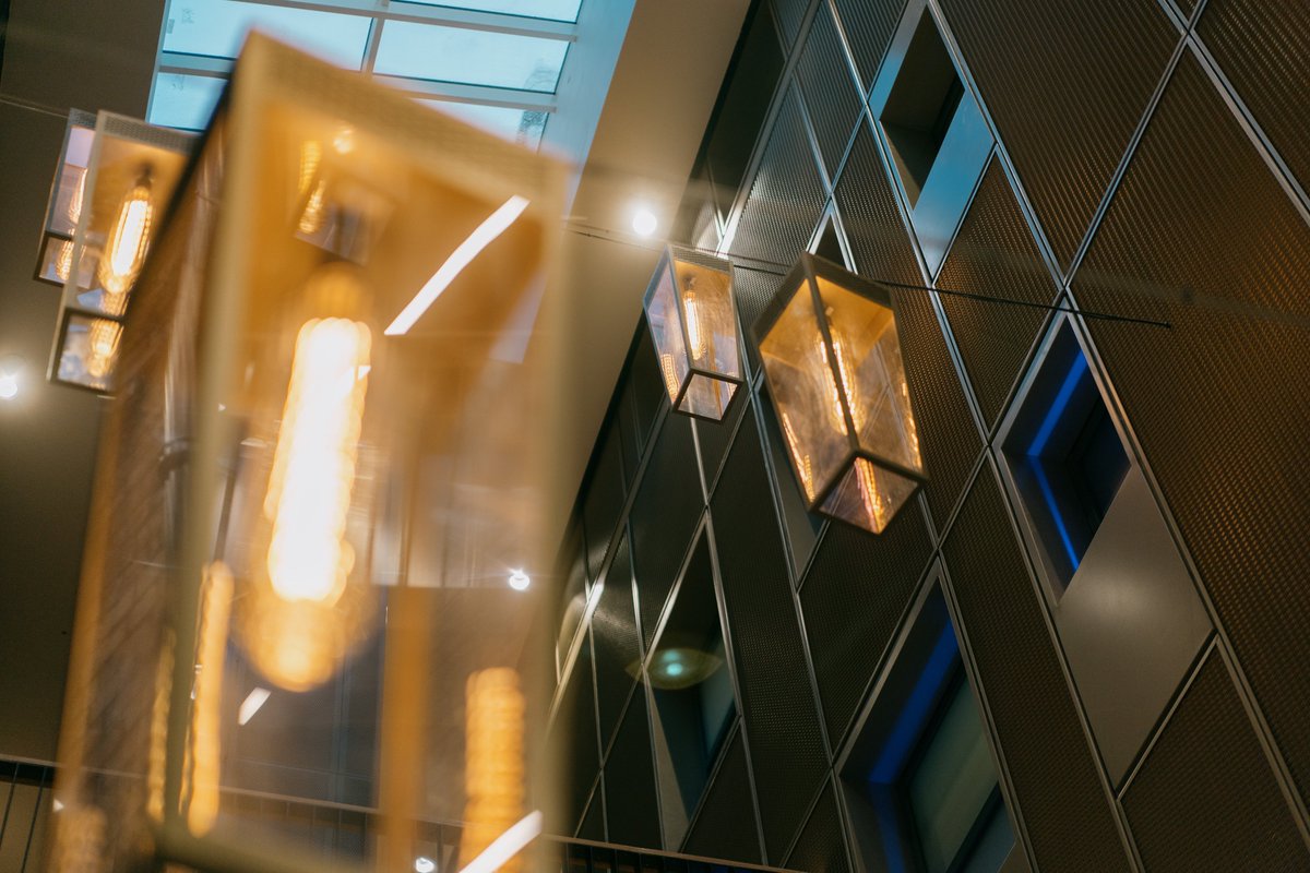 Bespoke feature pendants adding drama to the Howard Assembly Room atrium; designed as a contemporary interpretation of a Victorian gas-light.

Well-suited to a Grade 2* Listed estate first opened in 1878.

#operanorth #howardassemblyroom