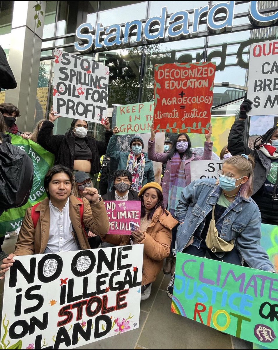 AnakbayanUK's tweet photo. Here’s more of us at the picket lines in front of the Standard Chartered Bank.

We also happened to stumble across @GretaThunberg during this picket. What a day! #ClimateJustice #ClimateCrisis #COP26 https://t.co/K8KKjKyxfs