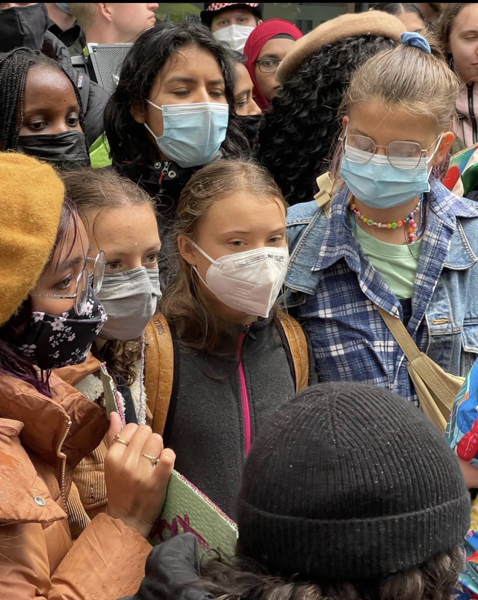 AnakbayanUK's tweet photo. Here’s more of us at the picket lines in front of the Standard Chartered Bank.

We also happened to stumble across @GretaThunberg during this picket. What a day! #ClimateJustice #ClimateCrisis #COP26 https://t.co/K8KKjKyxfs
