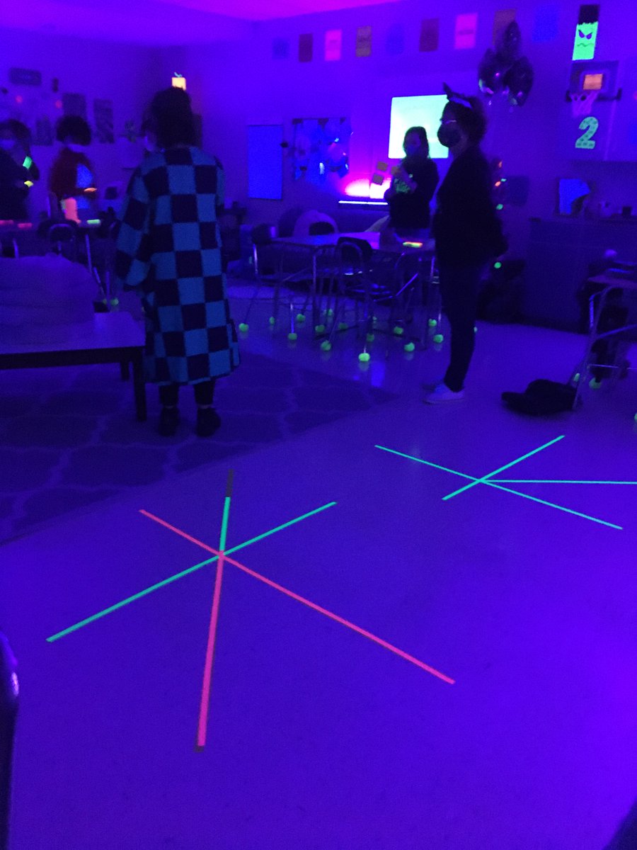 NewCenturyMS's tweet image. Students in Ms. Bell's math class got in the spirit by mastering angles while glowing in the dark! #spookymath