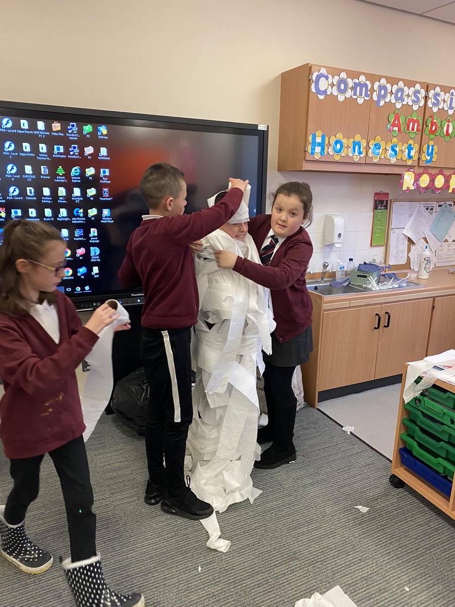 StMichaelsMissD's tweet photo. Super Mummy’s 🙌🏻 Great Team Work! Can you guess who is hiding in there? #fun #halloween https://t.co/TSbRR4rZWw