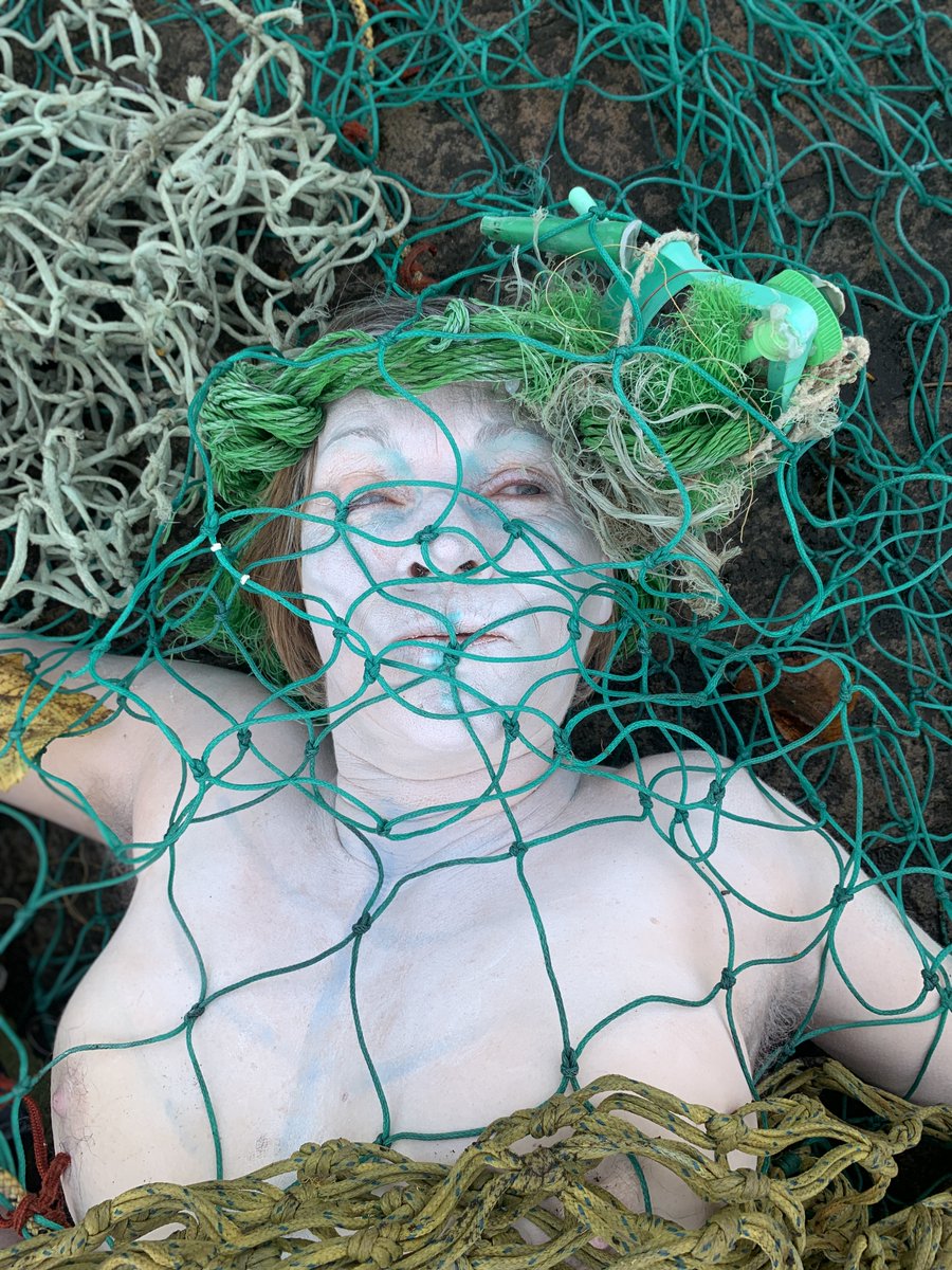 oceanrebellion's tweet photo. 'Dead' bycatch merpeople laid out on the freezing ground outside Glasgow's #CoP26 venue this morning. Ocean Rebellion is calling on world leaders to keep our ocean alive, and for an immediate global ban on destructive bottom trawling.
#NoMoreFishInTheSea
#DontTouchMyBottom https://t.co/FJI4QOShQ1