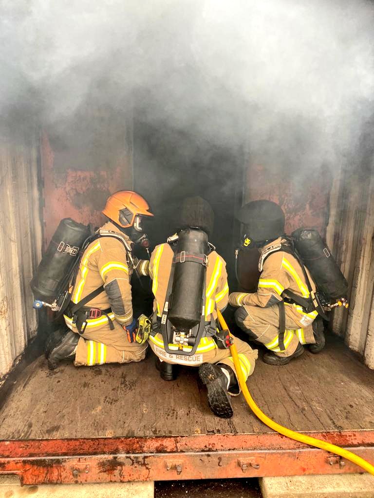 Our Phase One recruits watching a backdraft simulation followed by the Attack demo where they use firefighting techniques in Breathing Apparatus to control and advance into a compartment on fire.