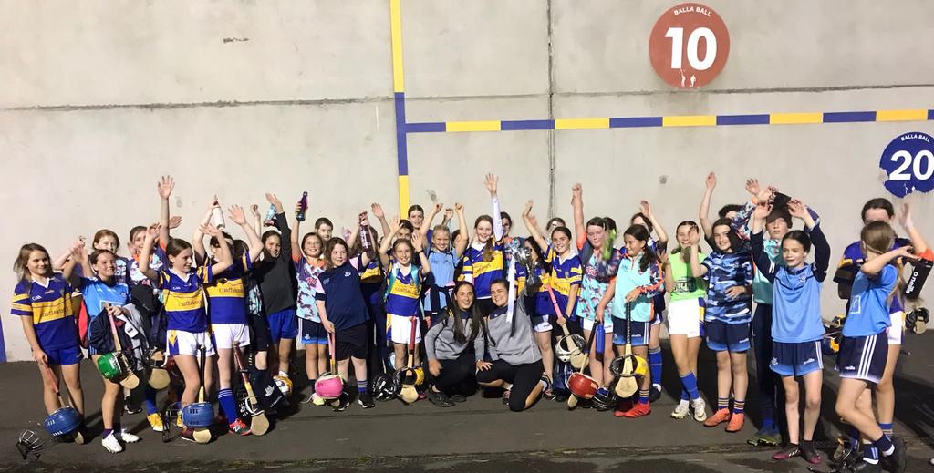 CastleknockGAA's tweet photo. Great to see two of our newly crowned Senior 2 Camogie champs Emma and Bronagh down showing off the silverware to our 2010 girls . Great role models and something for them to aspire to 👏🏻💙💛 @dublin_camogie #clubisfamily #futurestars #currentstars https://t.co/GAVJgW663w