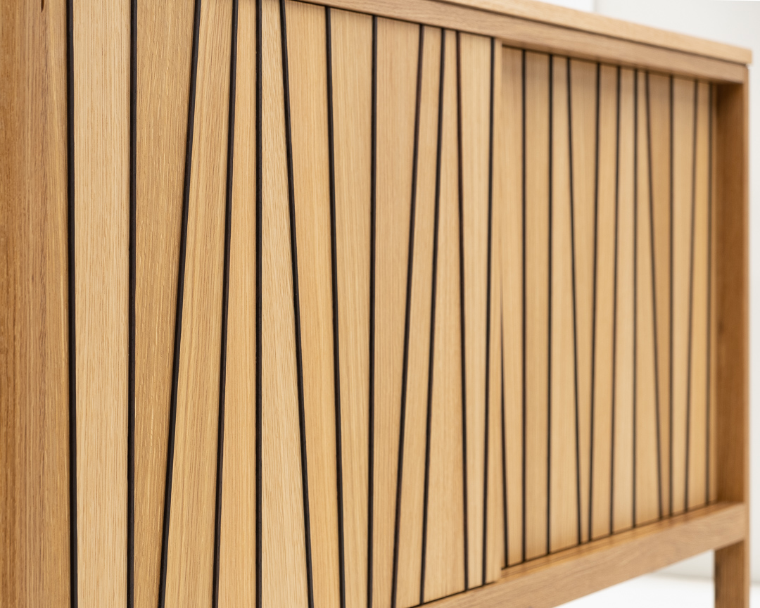 SolarFurniture's tweet photo. A small custom cabinet in white oak: The sliding doors feature a pattern of oak veneer and raised strips of dark wenge wood. 56"x29"x16" deep. https://t.co/ImUAUr66Jj