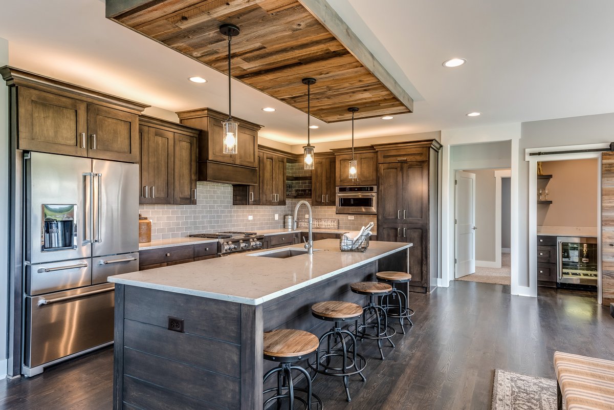 We love this dark stain kitchen design - particularly the stunning centrepiece island and pendant ceiling base. What do you think? 

#ottawakitchendesigner #ottawakitchens