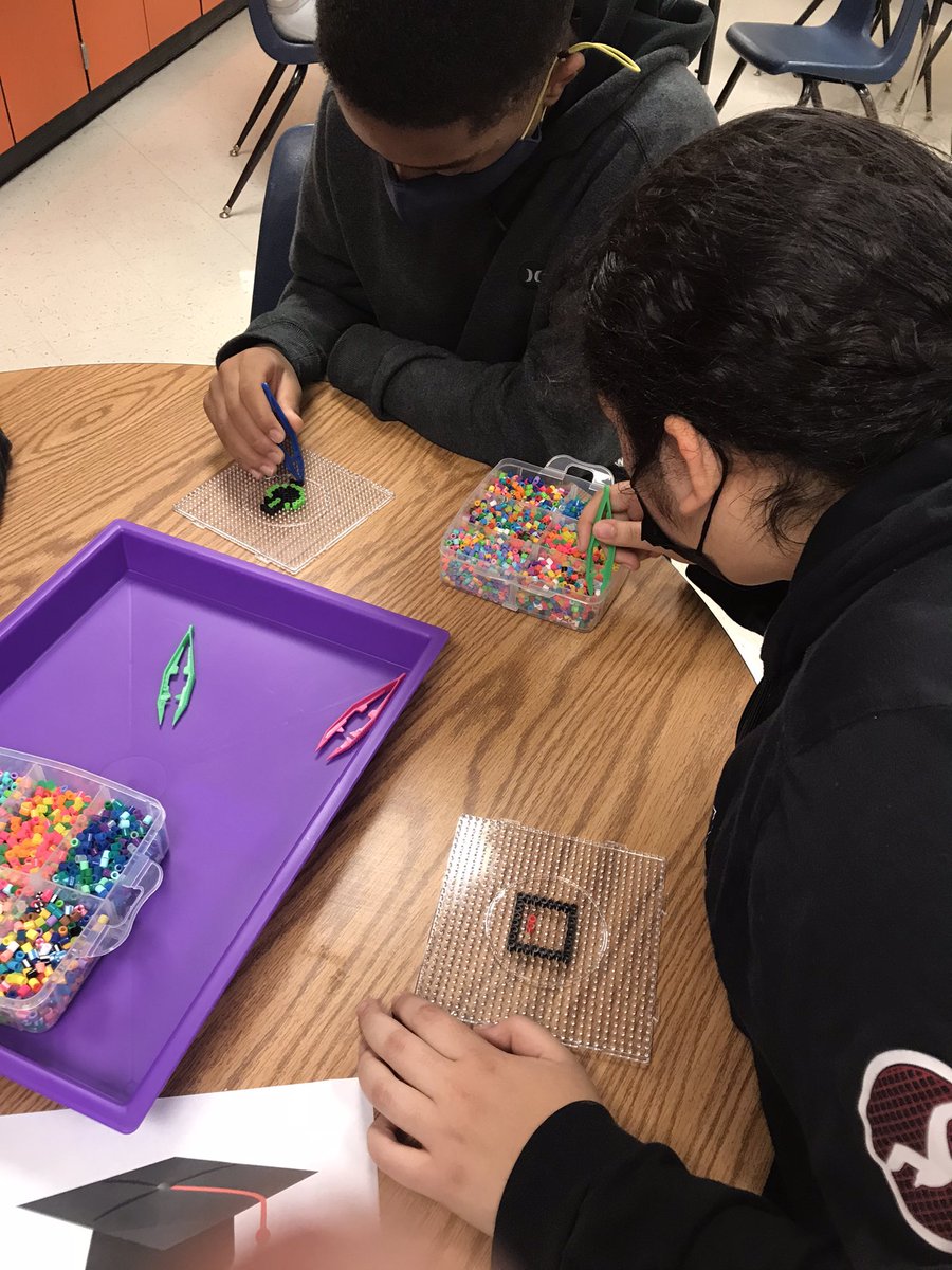 GriffinMSLLC's tweet photo. After reading the Alchemist, 8th grade students created a personal legend vision board. Then designed their own symbol that represents a goal in their future and made it into a keychain to keep as a daily reminder. #itwassofun #engagedstudents @tapn2Tapp @STEMcobb @CCSDLibMedia https://t.co/rG5tYovWrr