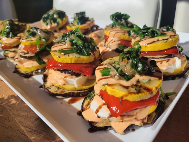 TastyTableCater's tweet photo. Fresh out of the kitchen is our delicious eggplant dish which includes roasted red pepper, squash, fresh mozzarella and wilted spinach - finished with homemade vodka sauce and a balsamic drizzle. Stop in today and grab a bite! https://t.co/qtXXRhTjeB
