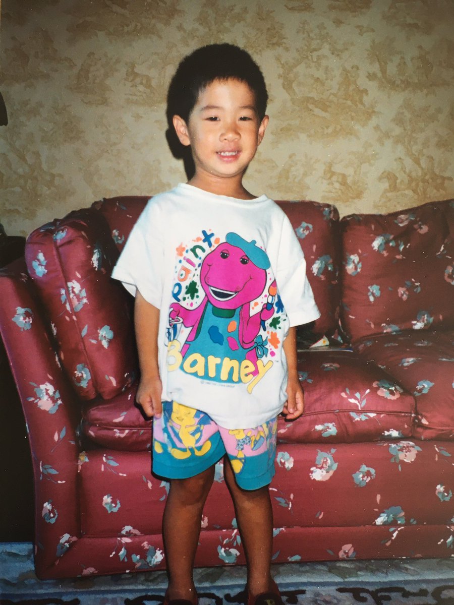 YogaMom8's tweet photo. Throwback to when my little guy dressed very colorfully with his Tweety Bird shorts!  Fun Fact: Did you know that @jamiemkwan loved Barney the dinosaur?  He watched Barney and Friends everyday on TV
#30daysto30 #countdown #momlife #birthday #birthdayboy #family #throwback #barney https://t.co/qJ3Hu9Tkrz