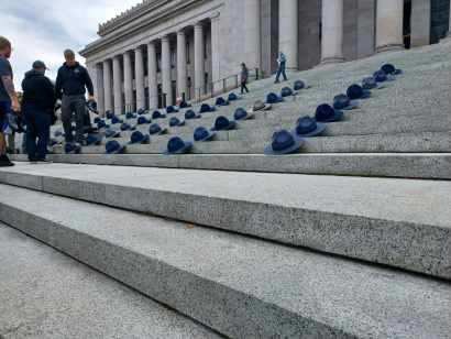 KelleeAzar's tweet photo. Today, now former troopers with Washington State Patrol laid their boots and campaign hats on the steps of the Capitol Building to show represent those lost because of the statewide vaccine mandate. #LiveOnK2 https://t.co/84WB7kUG4S