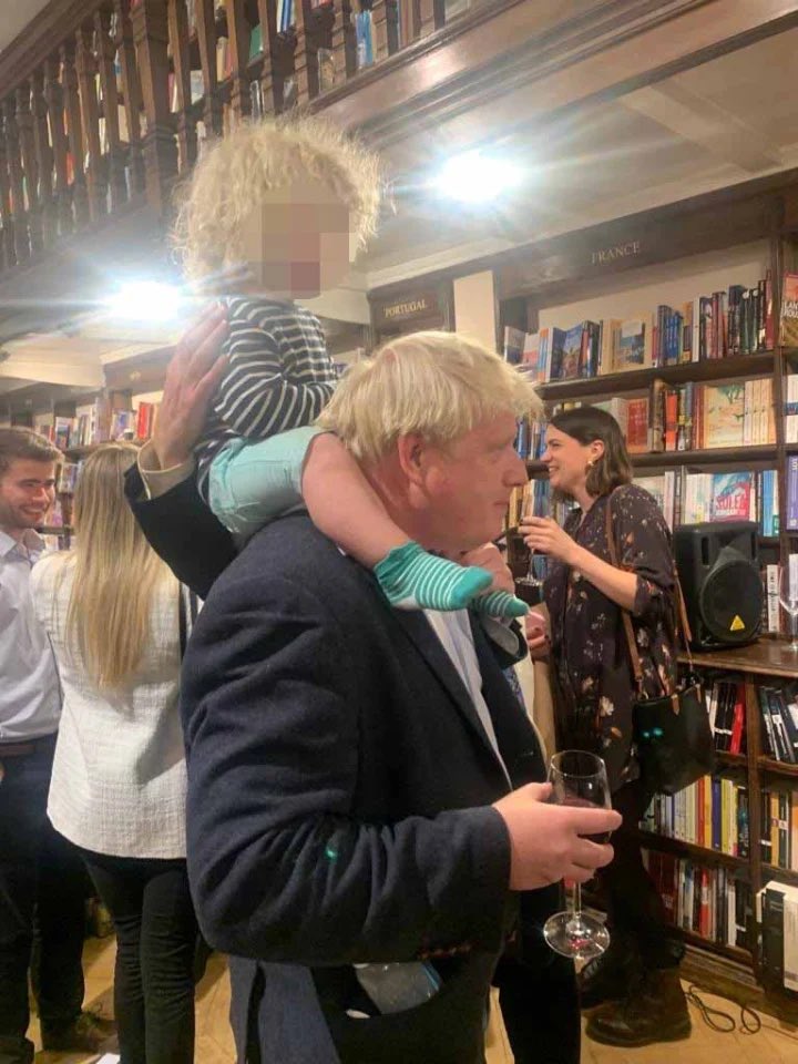I’ve seen lots of photos of children being carried on their parent’s shoulders.

This is one of the odder ones.