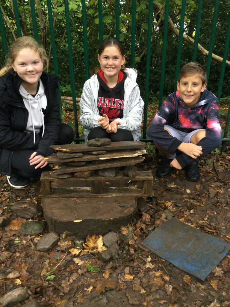PPSMrCleaves's tweet photo. A wonderful morning in the very damp forest classroom making rock statues based on the art work of English born artist Ted Harrison who moved to the Yukon. The stone statues are Inuit statues called Inukshuk. @PPSExpresiveArt #PentrepoethProud #PPSAllaboutlearning https://t.co/rXyOT8mzFu