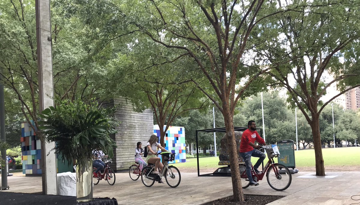 AnniseParker's tweet photo. Today @houparksboard celebrated the success of #BayouGreenways2020 at Discovery Green in downtown. This pic captures so much of what’s fun in Houston parks—trees, trails, greenspace, art, bikes to rent! #ParksByYou https://t.co/LN1UMrCE8T